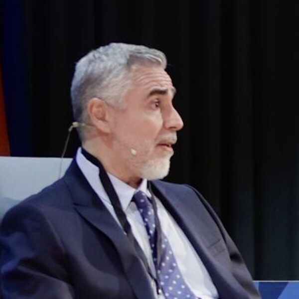 Sebastian J. Brau speaking at a panel — CEO of iLEAN, author of IRIS